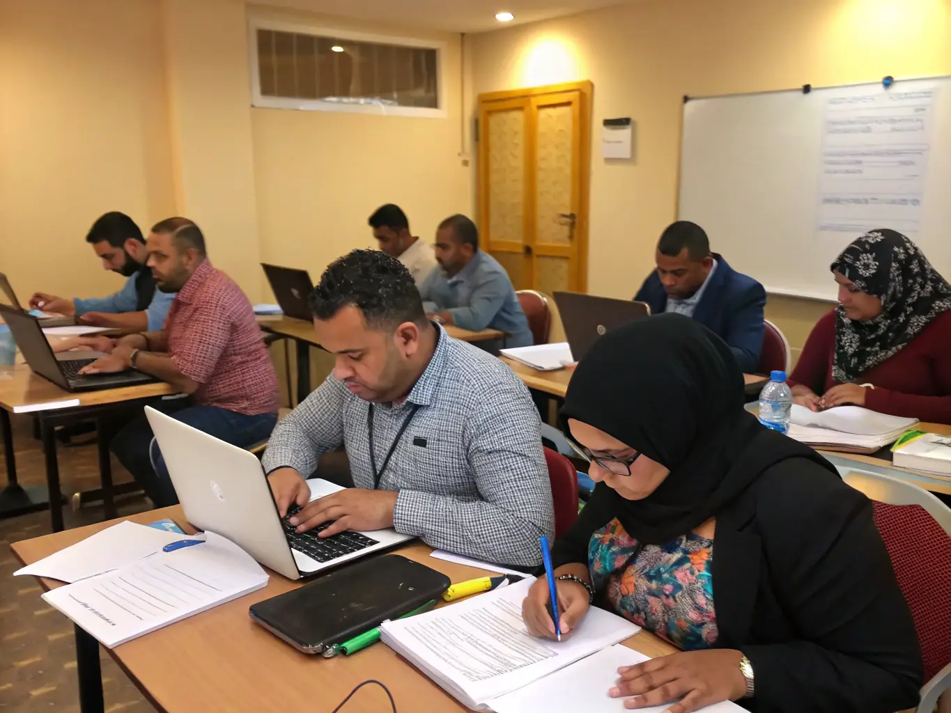An image showing young adults participating in a job readiness program, learning skills such as resume writing and interview techniques.